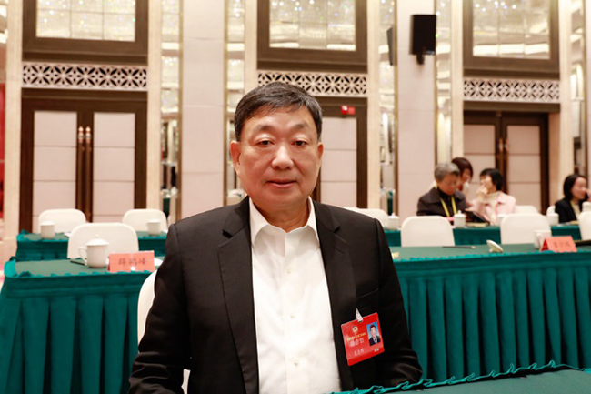 福建省政協(xié)常務(wù)委員、民建福建省委員會主委吳志明。受訪者供圖